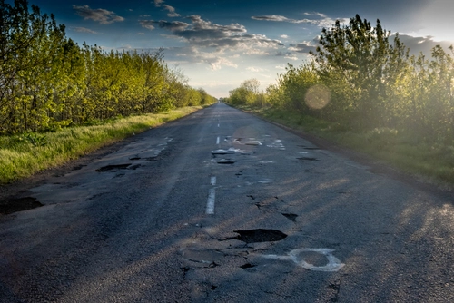 Country road with a lot of potholes