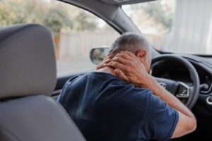 Man With Neck Pain in Car