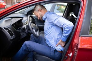 Man in Back Pain in Car