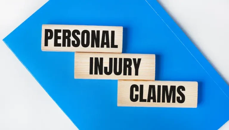 Wooden blocks on top of a folder have the words Personal Injury Claims.
