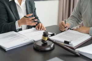 Lawyer negotiating with insurance adjuster on behalf of a car accident victim