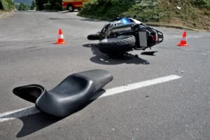 A wrecked motorcycle lying on the ground represents cases handled by a Charleston motorcycle accident lawyer