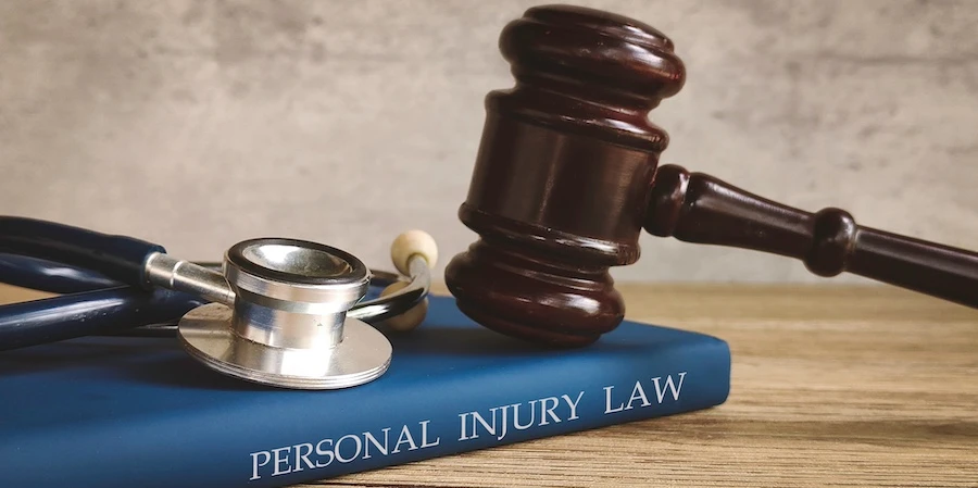 A gavel and stethoscope represent a personal injury lawyer.