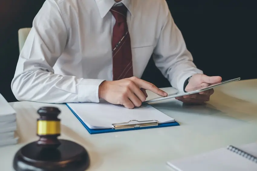 Beaufort catastrophic injury lawyer J. Olin McDougall reviewing a client's medical records
