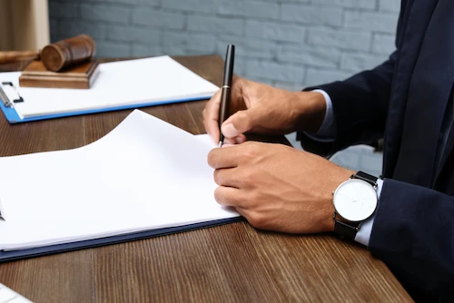 A Columbia motorcycle accident lawyer at McDougall Law Firm reviews legal documents.