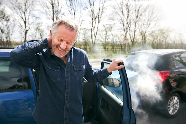 A senior man with neck pain wonders what to do after a car accident in South Carolina.