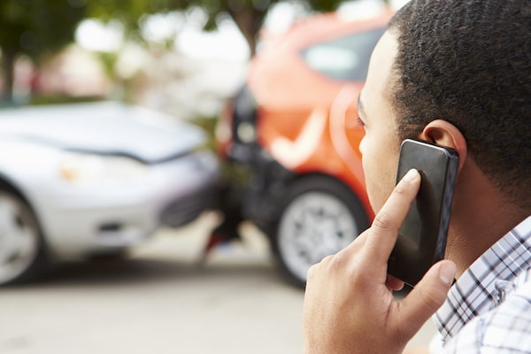 A driver calling 911 shows what to do after a car accident in South Carolina.